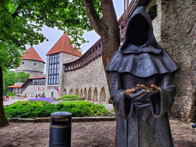 monk statue in talling old city on baltic itinerary